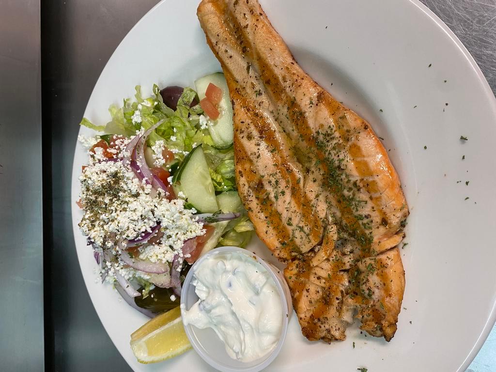 Salmon Fillet · Grilled with fresh herbs, served with a side salad.