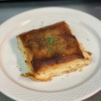 Tiropita · Phyllo pastry filled with feta cheese.