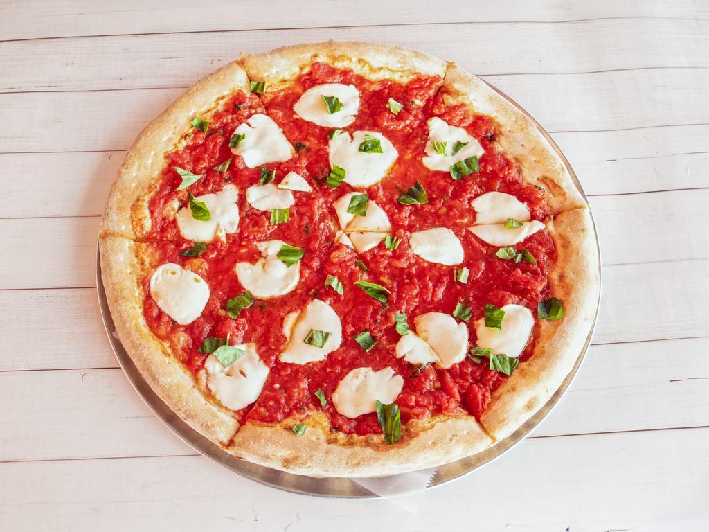 Margherita Pizza · Fresh mozzarella, tomato sauce basil and Parmesan.