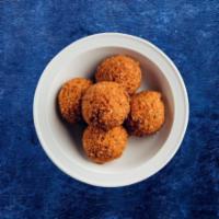 Just Falafel (4 Pcs) · Mashed chickpea and fava bean mix, seasoned with fresh herbs & pan fried crisp
