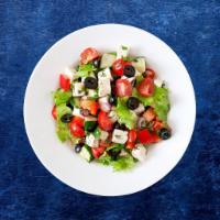 Greek-Goliath Salad · This delicious Greek salad consists of fresh romaine lettuce, minced juicy tomatoes and kala...