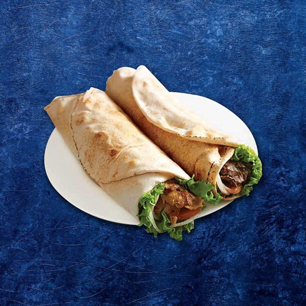 Beef Kabob Wrap · Marinated beef thinly sliced and wrapped in pita bread with tomato, cucumber, pickles, and feta cheese. Served with signature red and white sauces.