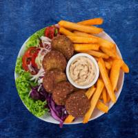 Falafel Frenzy Plate · Healthy. Fried veggie balls made fresh to order over spiced basmati rice and side salad. Ser...