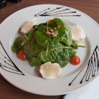 Goat Cheese and Spinach Salad · Honey, roasted pine nuts and balsamic vinaigrette.