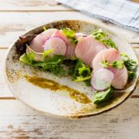 Yellowtail Carpaccio · Sliced yellowtail with jalapeno on top with ponzu sauce.
