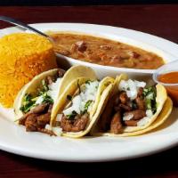 Street Tacos Plate · 3 tacos originally served with rice and charros beans.