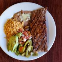 Carne Asada · Flavorful and juicy grilled steak. Served with grilled onions, rice, beans, lettuce, pico de...