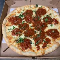 Margherita Pizza · White pizza with marinara sauce with olive oil and fresh basil.