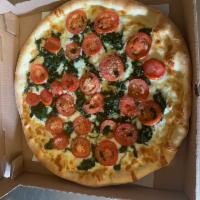 Rústica Pizza · Spinach, plum tomatoes, fresh garlic, olive oil and mozzarella cheese.