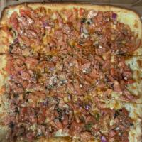 Bruschetta Pizza · Chopped tomatoes, fresh basil, mozzarella, olive oil and garlic.chopped onions 