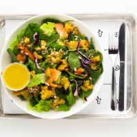 Tropical Mix Salad · Natura mix greens, sweet plantains, tomato, and sunflower seeds with aderezo de jengibre y l...