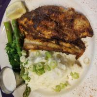 Blackened Catfish · Delta farm raised catfish, blackened and served with horseradish sauce. Served with choice o...