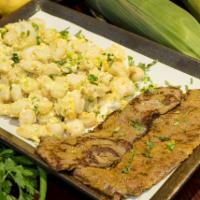 Mote Pillo, Mote Revuelto con Huevos y Carne Frita · Hominy mixed with scramble eggs, served with fried steak.