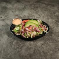 Ensalada Regular · Regular salad. Lettuce, tomatoes, onions and cucumbers. Served with oil and vinegar.