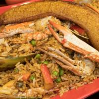 Arroz con Mariscos · Mixed seafood fried with rice and sweet fried plantain.