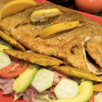 Pargo Frito · Red snapper with salad and fried green plantain.