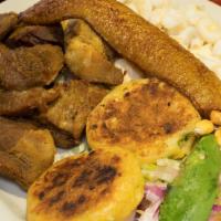 Fritada · Fried cube pork served with hominy, fried plantain and salad.