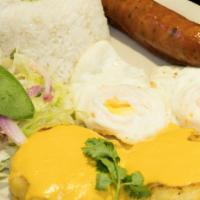 Yapingacho Ambateno · Potato patties, rice, fried eggs, sausage and salad.