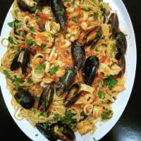 Pasta with Frutti Di Mare · Calamari, shrimp, baby clams & mussels