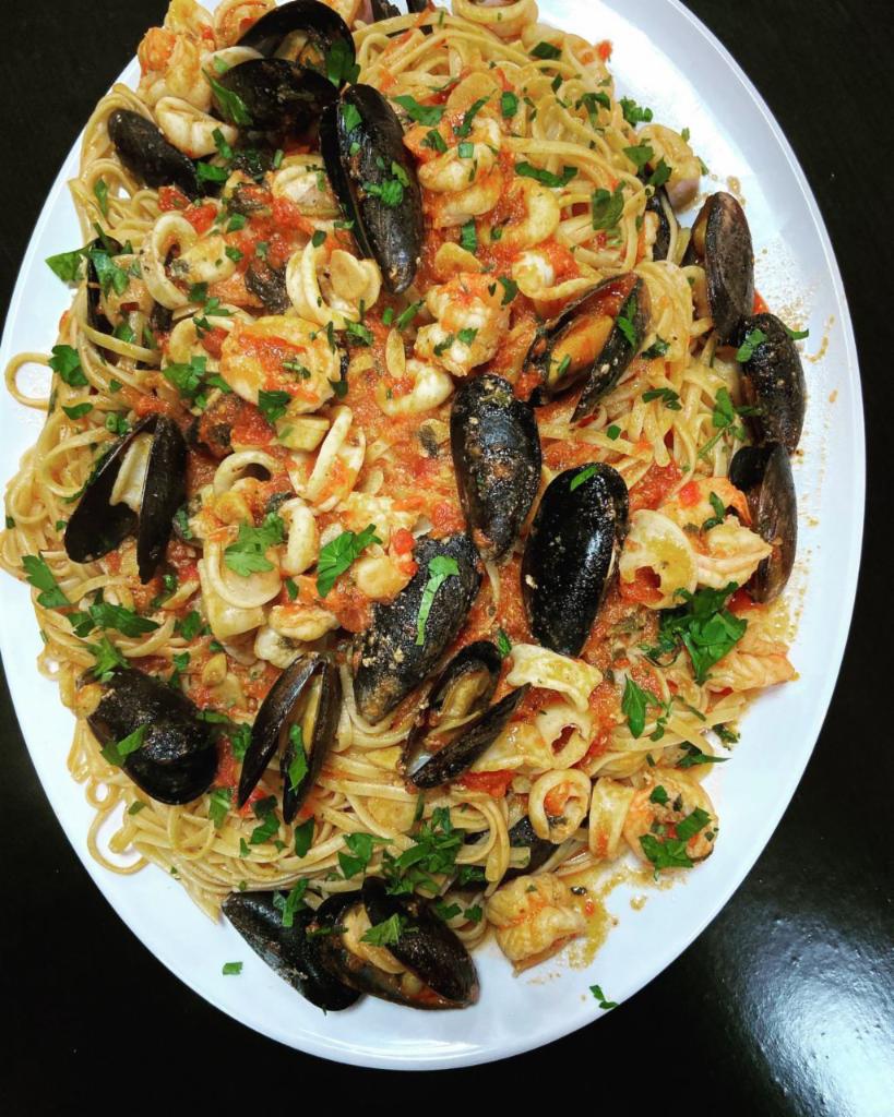Pasta with Frutti Di Mare · Calamari, shrimp, baby clams & mussels