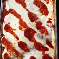 Chicken Parmigiana · breaded chicken cutlets covered in tomato sauce and mozzarella and parmesan cheese