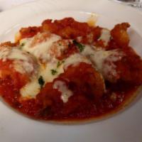 Shrimp Parmigiana · breaded shrimp covered in tomato sauce and mozzarella and parmesan cheese