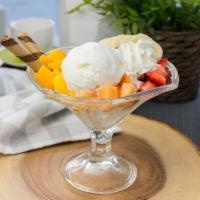 I03. Coconut Mixed Fruit Sundae · Coconut ice cream with mangoes, strawberries, cantaloupe, and banana