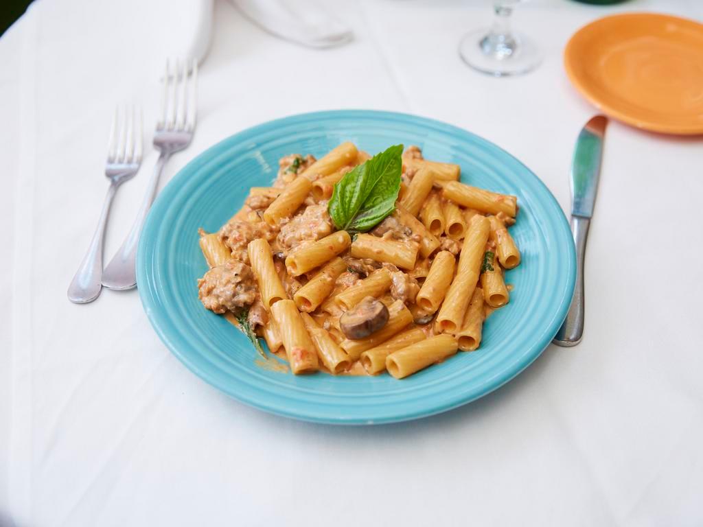 Rigatoni Norcia · Rigatoni sauteed with sausage and mushrooms in a pink sauce.