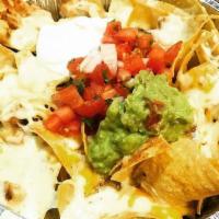 Nachos · Fresh corn chips, choice of beans, guacamole, sour cream, fresh salsa with melted jack and c...