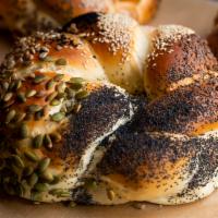 Festive Challah · Round, braided challah with a seed selection - sesame seed, nigella seeds, sunflower seeds, ...
