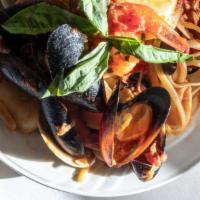 Zuppa Pescatore · A combination of shrimp, scallops, mussels, calamari, clams in a marinara, white, or fra dia...