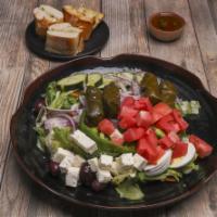 Greek Salad · Garden salad with feta cheese and anchovies upon request.