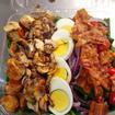 House Spinach Salad · Baby spinach, tomato, green peppers, egg, onions, cucumbers, and olives.