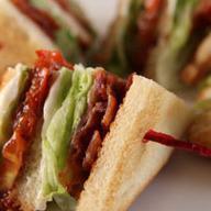 BLT Club Sandwich · 3 slices of bread and two layers of filling with bacon, lettuce, and tomato.
