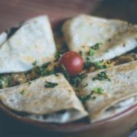 Burger Quesadillas · Cooked tortilla that is filled with cheese and folded in half with grilled or fried patty. 