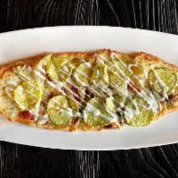 Dill Pickle Flatbread · Mozzarella, bacon, garlic cream, pickles, dill and ranch
