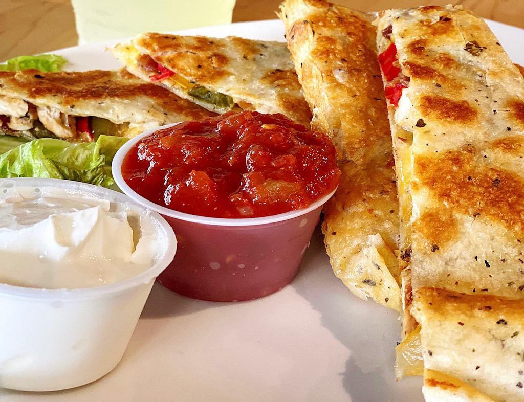 Famous Quesadillas · Grilled chicken, cheddar cheese, peppers, onions, bacon, salsa, and sour cream on the side. Cut to 4 pieces.