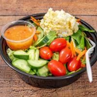 Egg Salad · green salad topped with shredded carrots, grape tomatoes, sliced cucumbers, and a scoop of o...