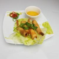 Rollos de camarones / Shirmp roll  · Large shrimp, Thai herbs wrapped in a crispy skin spring roll with chili-garlic sauce.