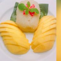 Mango with Sweet Sticky Rice · Sliced mango with coconut milk sticky Rice.