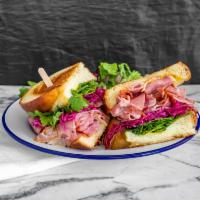 Pastrami sandwich · Toasted challah bread with pastrami, lettuce, pickled red cabbage, red onion, and mustard. 
...
