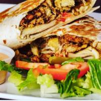 Chicken Shawarma  · Grilled Shawarma seasoned Chicken wrapped in large pita bread with onion. Olives, Shredded c...