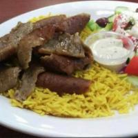 Shawarma platter  · Rotisserie Chicken shawarma on bed of a Saffron basmati rice, with side of salad Tatziki sau...