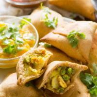 Vegetable samosa  · Puff pastry pocket filled with seasonal vegetables, Moroccan spices and herbs, lightly fried...