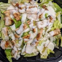 Chicken Caesar Salad · Grilled Chicken on top of fresh romaine lettuce , Caesar dressing on top