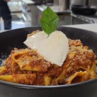 Bolognese Pasta · Fresh pappardelle, house made meat sauce, and ricotta.