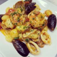 Frutti di Mare · Gnocchi, baby manila clams, mussels, calamari, jumbo gulf shrimp, and white wine cherry toma...