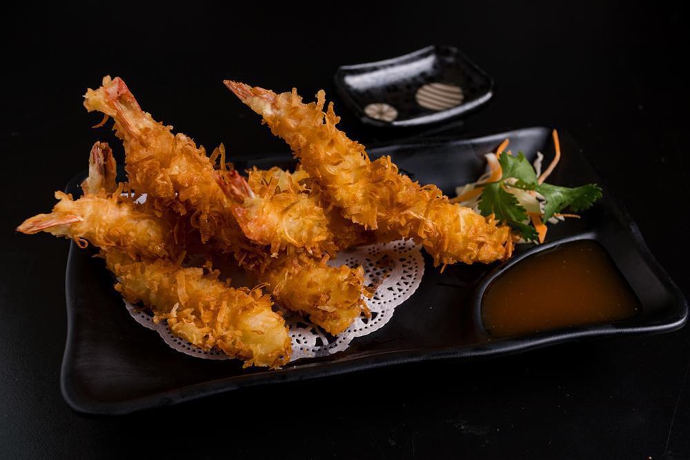 Coconut Shrimp · With sweet chili sauce.