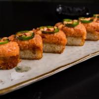 Crispy Rice Spicy Salmon · Crispy rice top with spicy salmon, jalapeno, eel sauce and spicy mayo.