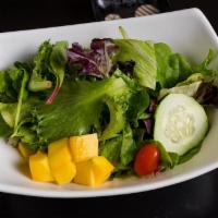 Exotic Green Salad · Mix green and mango with ginger dressing.